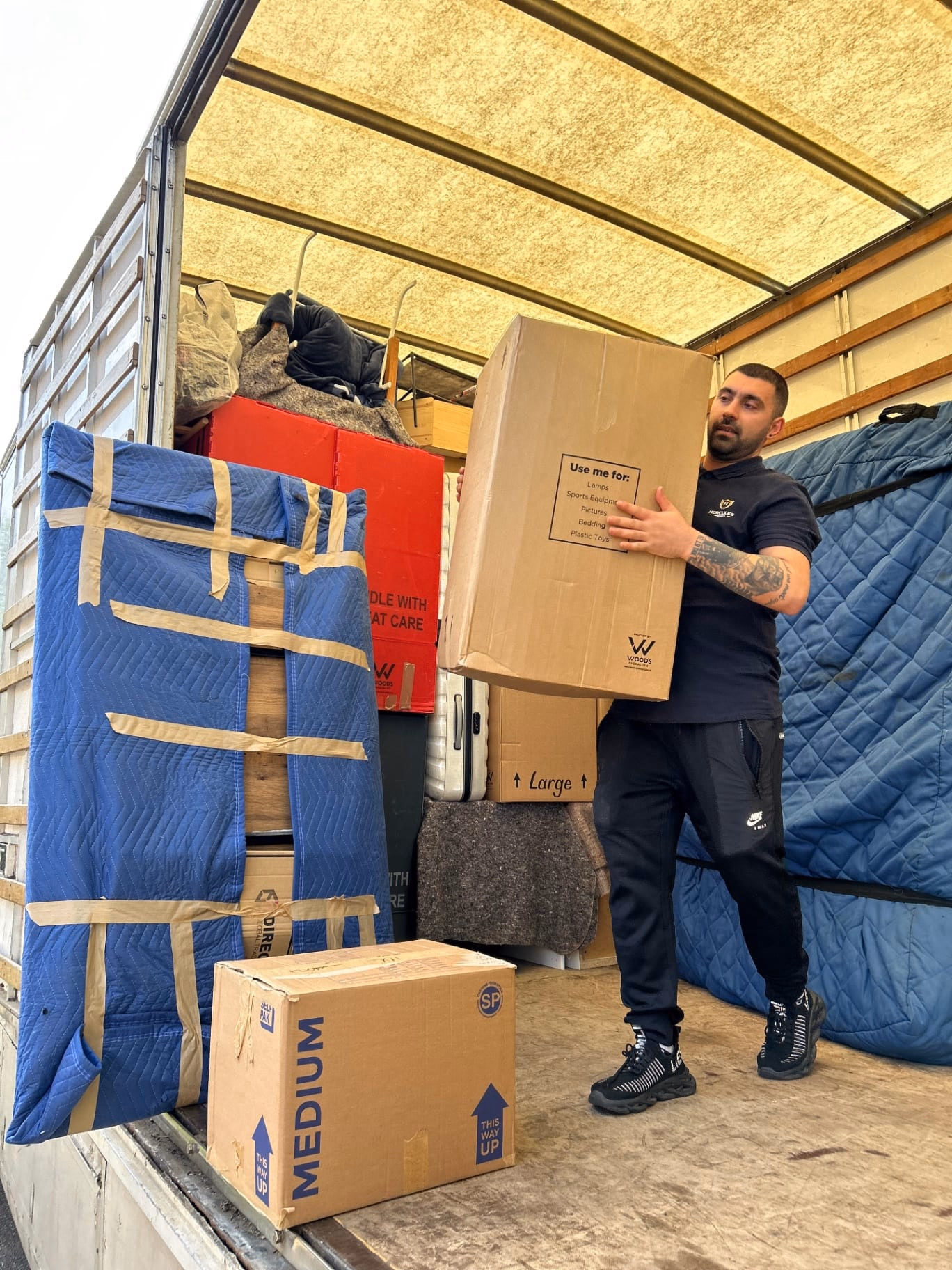 Hercules mover loading boxes into truck